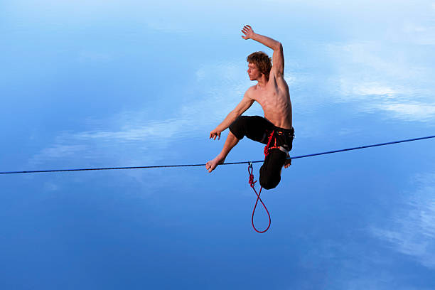 istock Slackling high above the water at dusk. 468353037