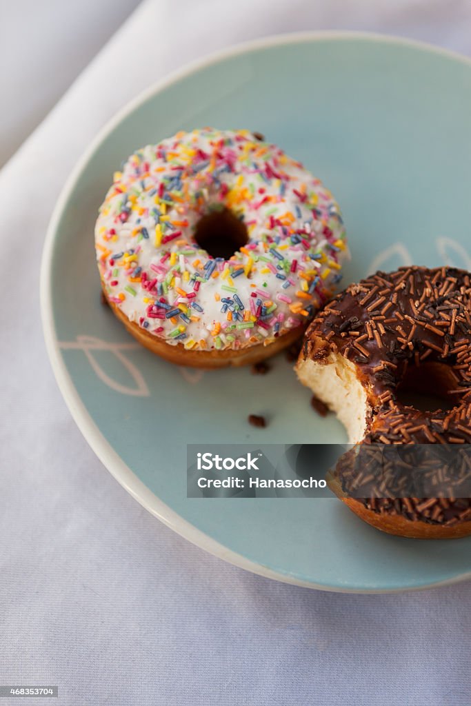 Top view of two doughnuts Ceramic plate with two doughnuts viewed from above 2015 Stock Photo