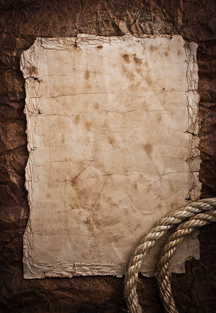 istock aged Rope on the old paper background 468357032
