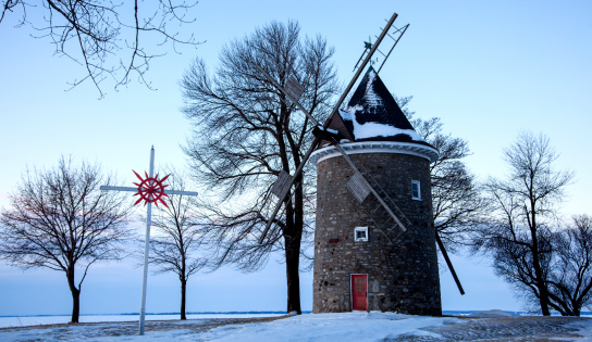 This is a historic windmill next to a CND convent and church (St. Joachim) in Pointe Claire, Quebec, on a point where Easter sunrise services have been held for many years. This shot, however, was taken on a bitterly cold morning with a brisk wind off the water ... er, ice ... February 8, 2014