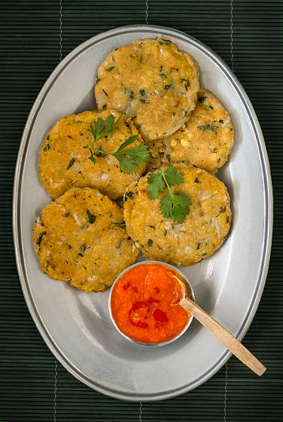 istock Delicious Plantain Patties on Silver Platter with Chilli Sauce 468359274