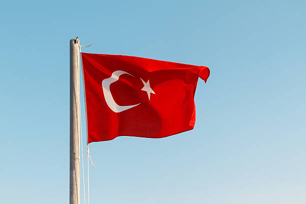 istock Turkish flag waving against a blue sky 468359448