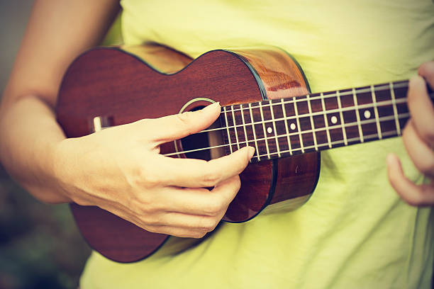 istock Woman playing ukulele, vintage style. 468368368