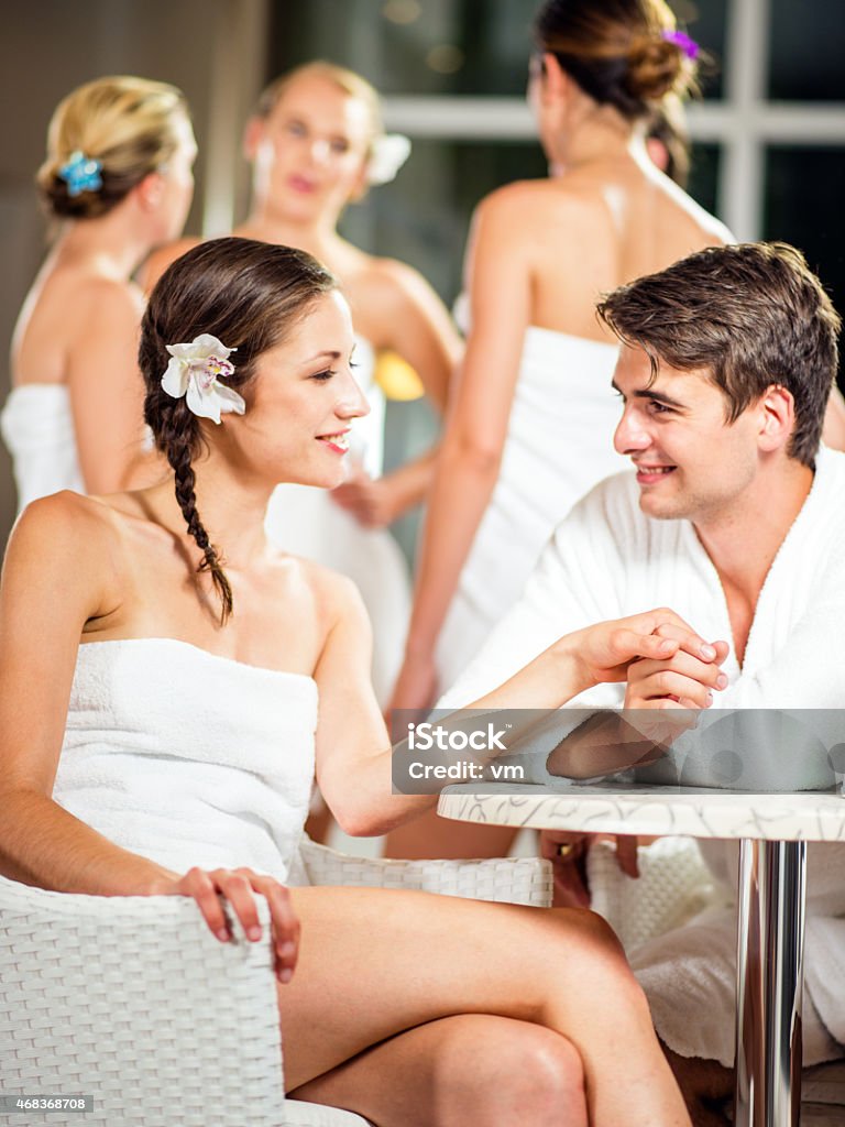 Young Couple Having a Romantic Conversation in a Spa Relaxing and Talking at the spa. Alternative Therapy Stock Photo