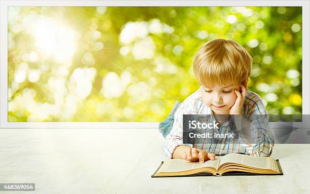 Young Child Boy Reading Book Children Early Development Kid Education Stock Photo - Download Image Now