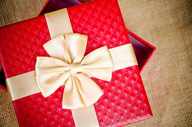 istock Red gift box with gold  ribbon 468369436
