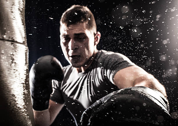 istock A boxer punching towards the camera with lens flare 468372102