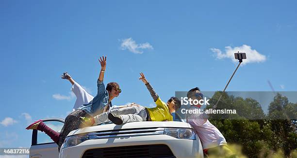 Travelers Taking Photo Themselves Stock Photo - Download Image Now - Car, Family, Asian and Indian Ethnicities