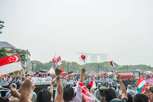 Singapore, Singapore - March 29, 2015: Thousands lined an almost 10-mile stretch of central Singapore in driving rain as the city prepared to farewell first prime minister Lee Kuan Yew