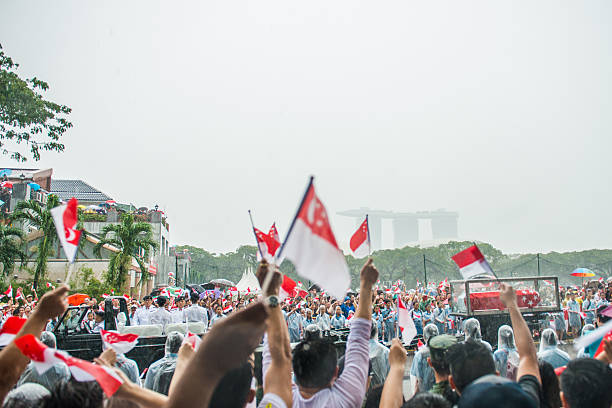 Singapore, Singapore - March 29, 2015: Thousands lined an almost 10-mile stretch of central Singapore in driving rain as the city prepared to farewell first prime minister Lee Kuan Yew