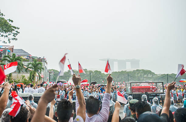 Singapore, Singapore - March 29, 2015: Thousands lined an almost 10-mile stretch of central Singapore in driving rain as the city prepared to farewell first prime minister Lee Kuan Yew