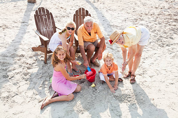 istock Children with grandparents on beach 468373145