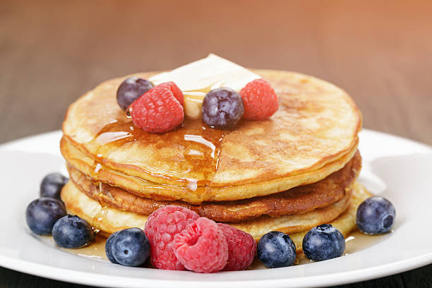 istock Classic pancakes with butter berrys and maple syrup 468375280