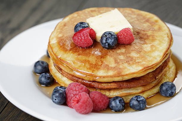 istock Classic pancakes with butter berrys and maple syrup 468375294
