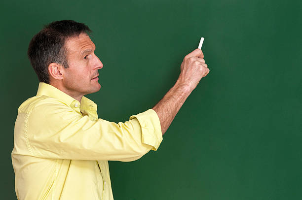 attraktive lehrerin an tafel schreiben - blackboard writing chalk teacher stock-fotos und bilder