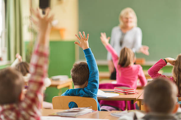 istock Rear view of school children ready to answer the question. 468379728