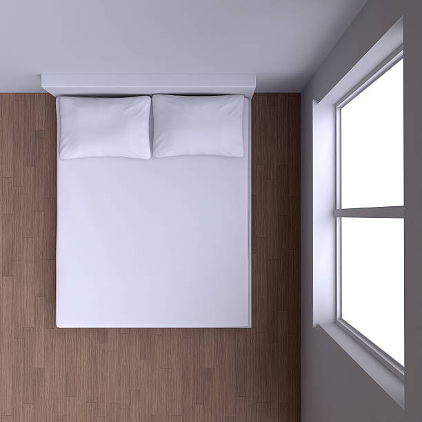 istock Bed with pillows and  in the corner room with window. 468379900