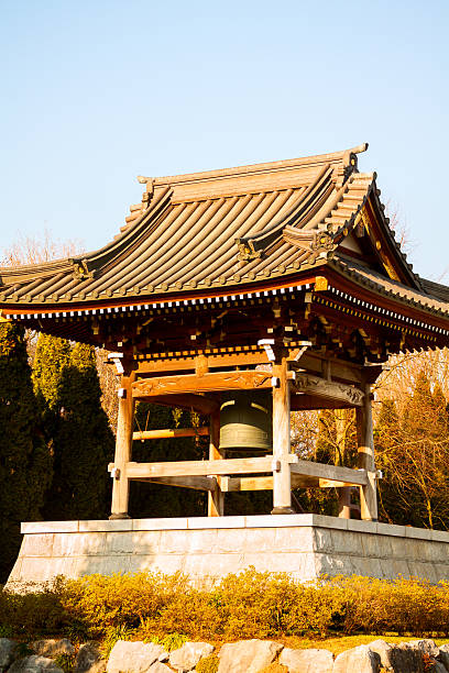 istock Buddhist bell in golden winter sun 468379987