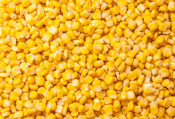 сжатый кукуруза фоне - corn kernel стоко�вые фото и изображения