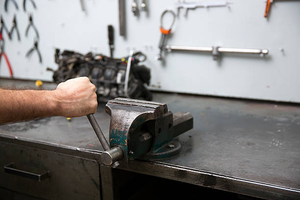 istock Hand of auto mechanic with a clamp 468382540