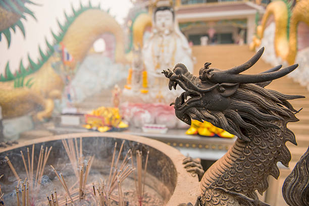 istock Chinese joss stick pot and dragon statue 468385666
