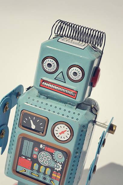 istock Vintage tin toy robot isolated on white background 468386055