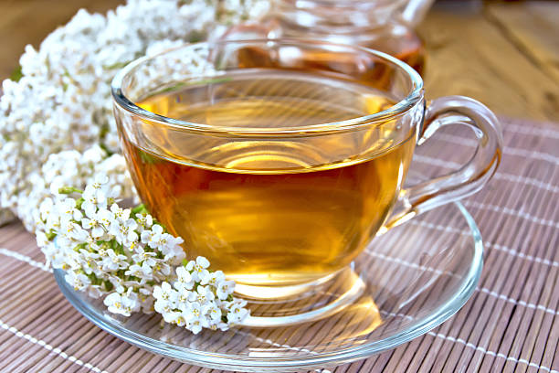 istock Tea with yarrow in cup on bamboo napkin 468386124