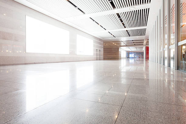 istock empty long corridor in the modern office building with billboard 468386316