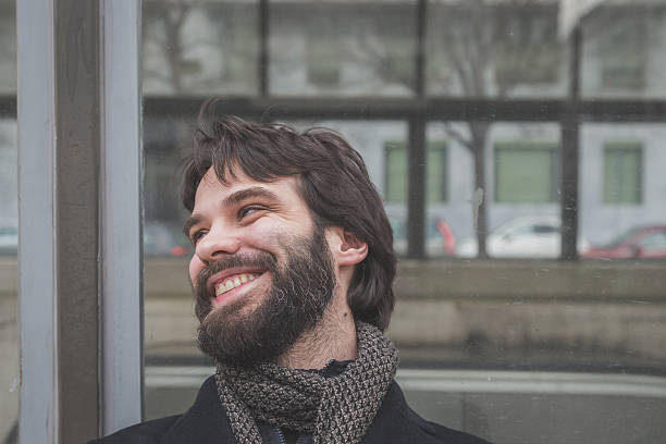 istock Young handsome bearded man posing in the city streets 468389596