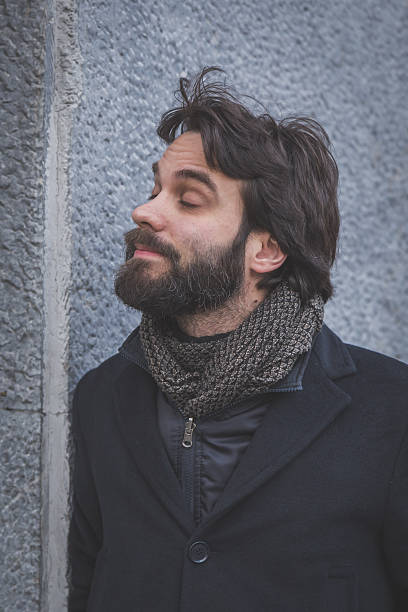 istock Young handsome bearded man posing in the city streets 468391804