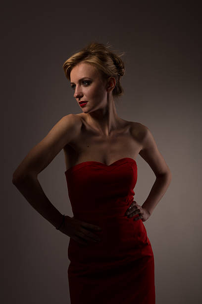 istock Lady in red posing for fashio 468392140