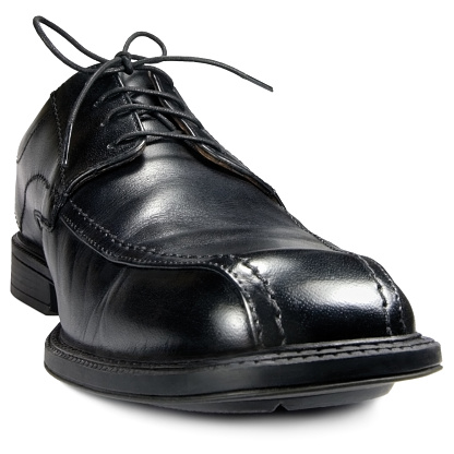 Classic men's black club shoe, isolated wide angle macro closeup studio shot