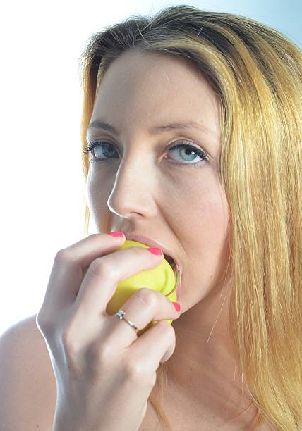 istock Young woman with green apple 468393223