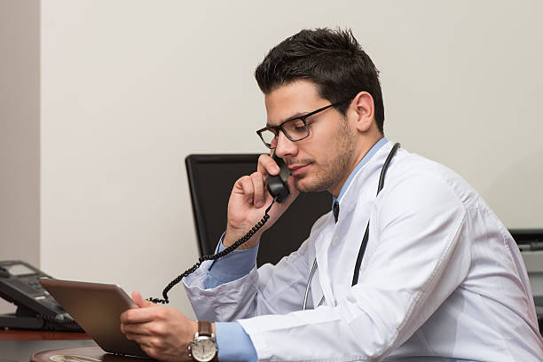 istock Young Doctor On The Phone 468399922