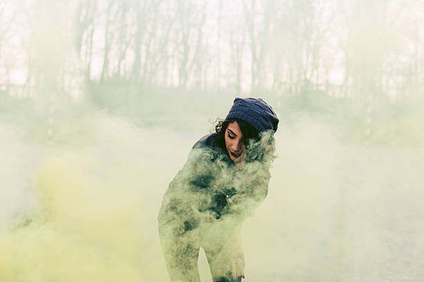 istock Hipster girls holding blue smoke 468400546