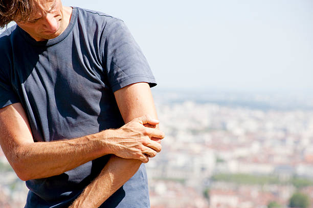 Pain in elbow stock photo