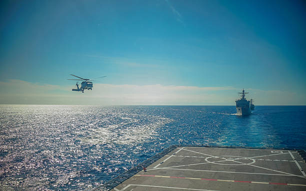 istock Helicopter landing on warship 468404182
