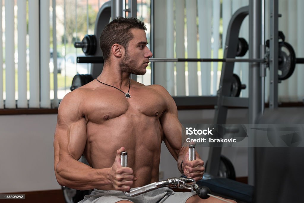 Young Man Doing Back Exercises In The Gym Male Fitness Athlete Doing Heavy Weight Exercise For Back 2015 Stock Photo