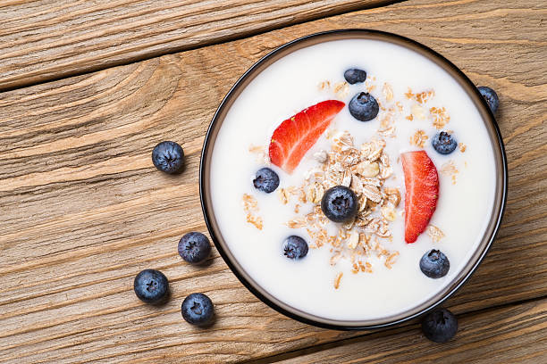 istock Muesli with yoghurt and fresh berries blueberries with strawberries 468405736