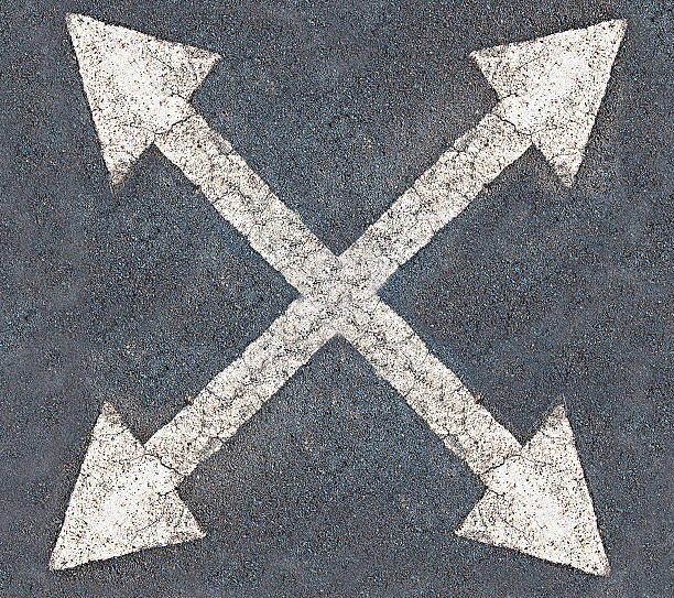 istock White arrow 4 direction on the road background 468406071