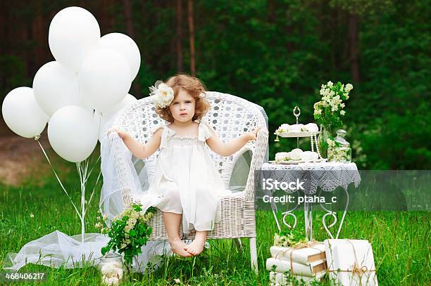 Beautiful Little Girl In White Decorations Stock Photo - Download Image Now - Beauty, Book, Child