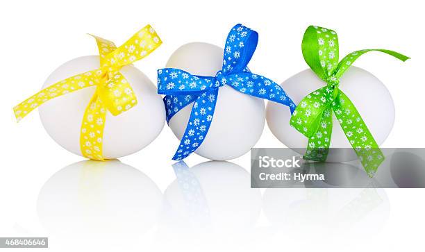Three Easter Eggs With Festive Bow Isolated On White Background Stock Photo - Download Image Now