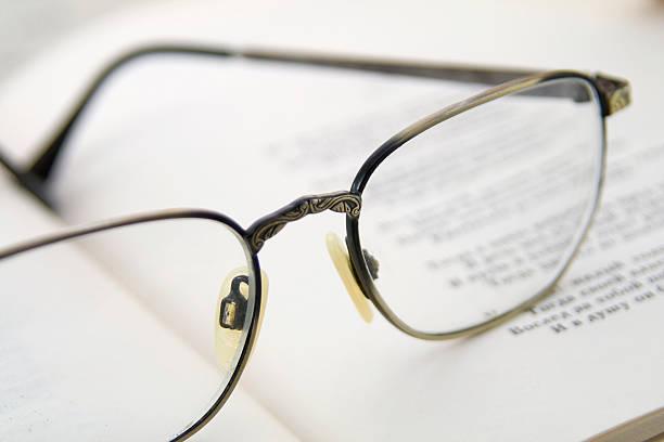 istock Glasses on the book. Macro shoting 468409351