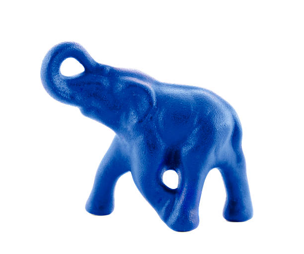 istock Blue figurine of an elephant isolated over white background 468411611