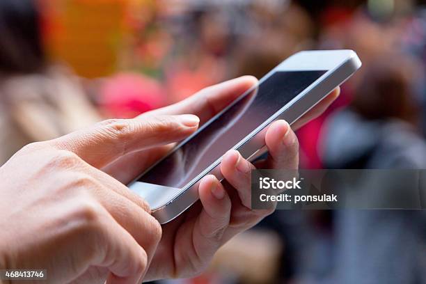 Closeup Of A Woman Using Smart Phone With Blurry Background Stock Photo - Download Image Now