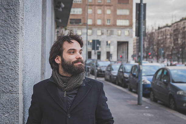 istock Young handsome bearded man posing in the city streets 468414238