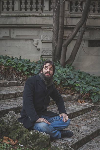 istock Young handsome bearded man posing in the city streets 468414240