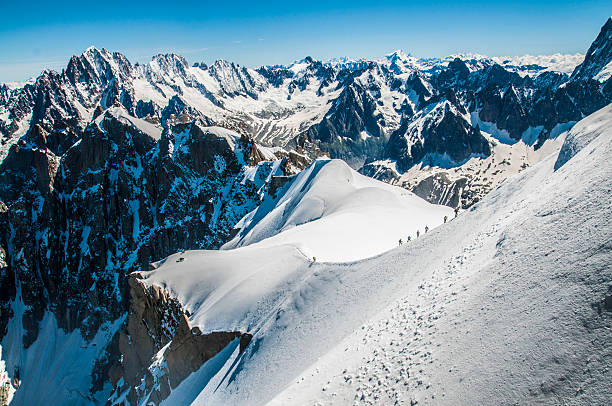 istock climbers climbing a mountain in european alps 468416872