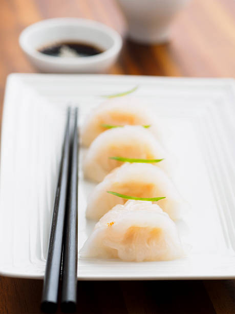 istock Prawn dumplings on plate with soy sauce and chopsticks. 468417130