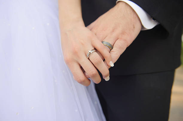 istock Bride and Groom Holding Hands 468417468